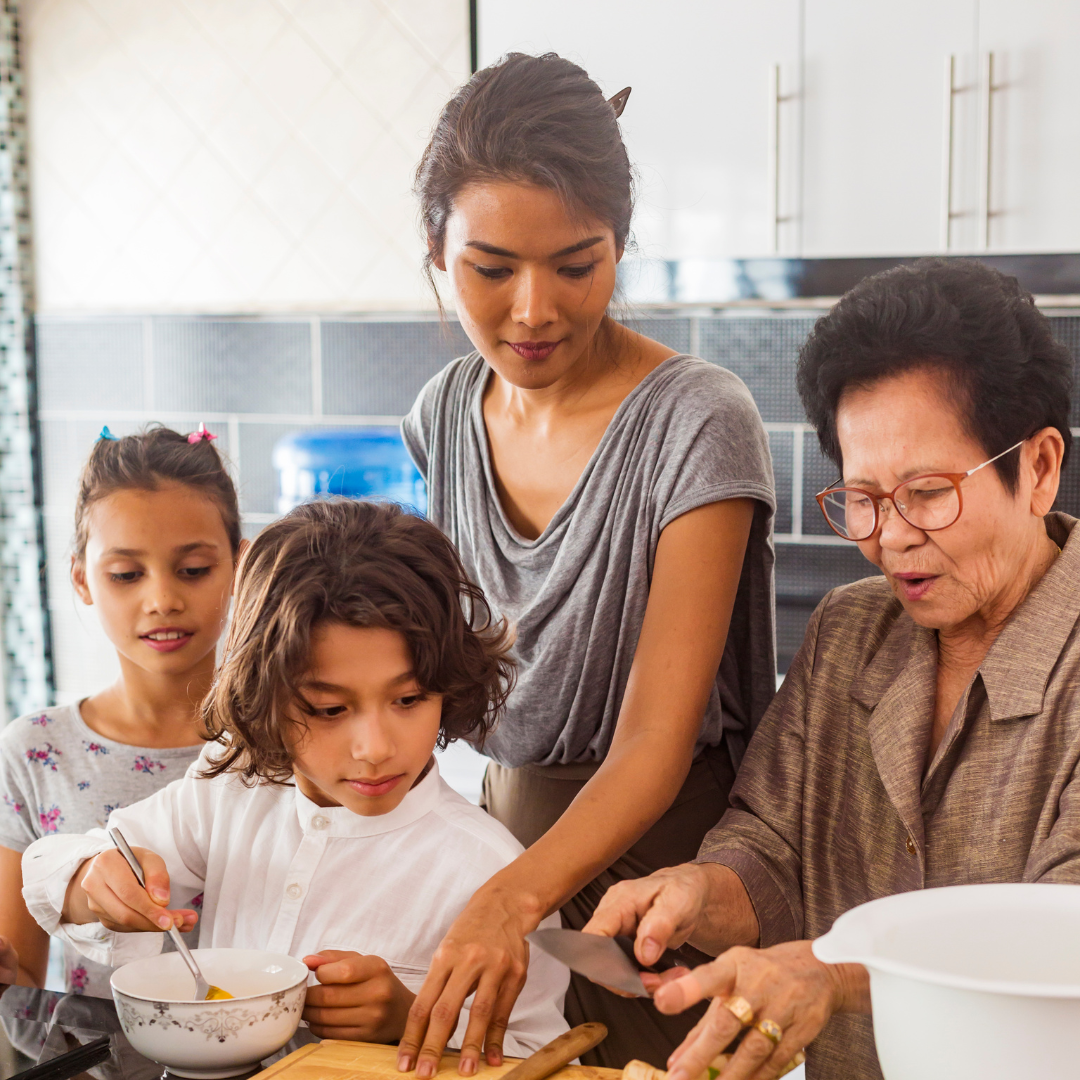 Multi generational family cooking together