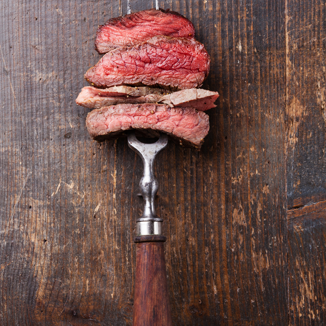 Red meat on a serving fork