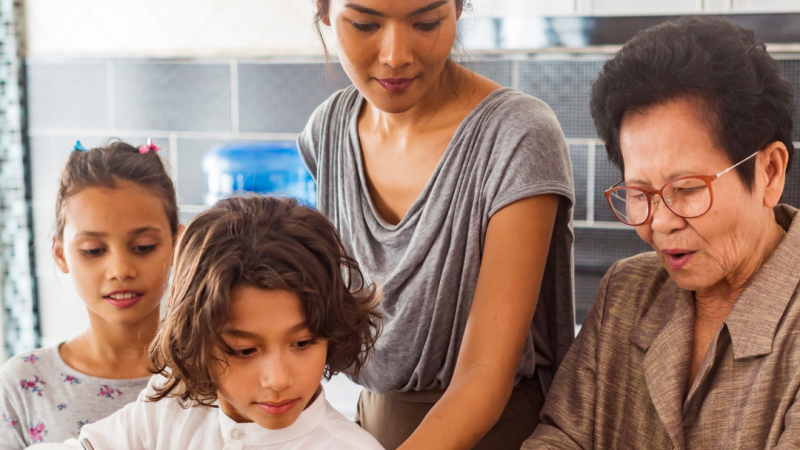 Multi generational family cooking together